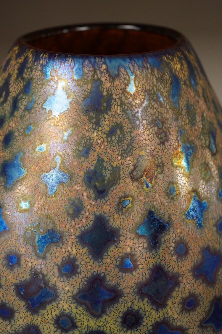 Siddy Langley, a blue iridescent glass vase, 23cm high